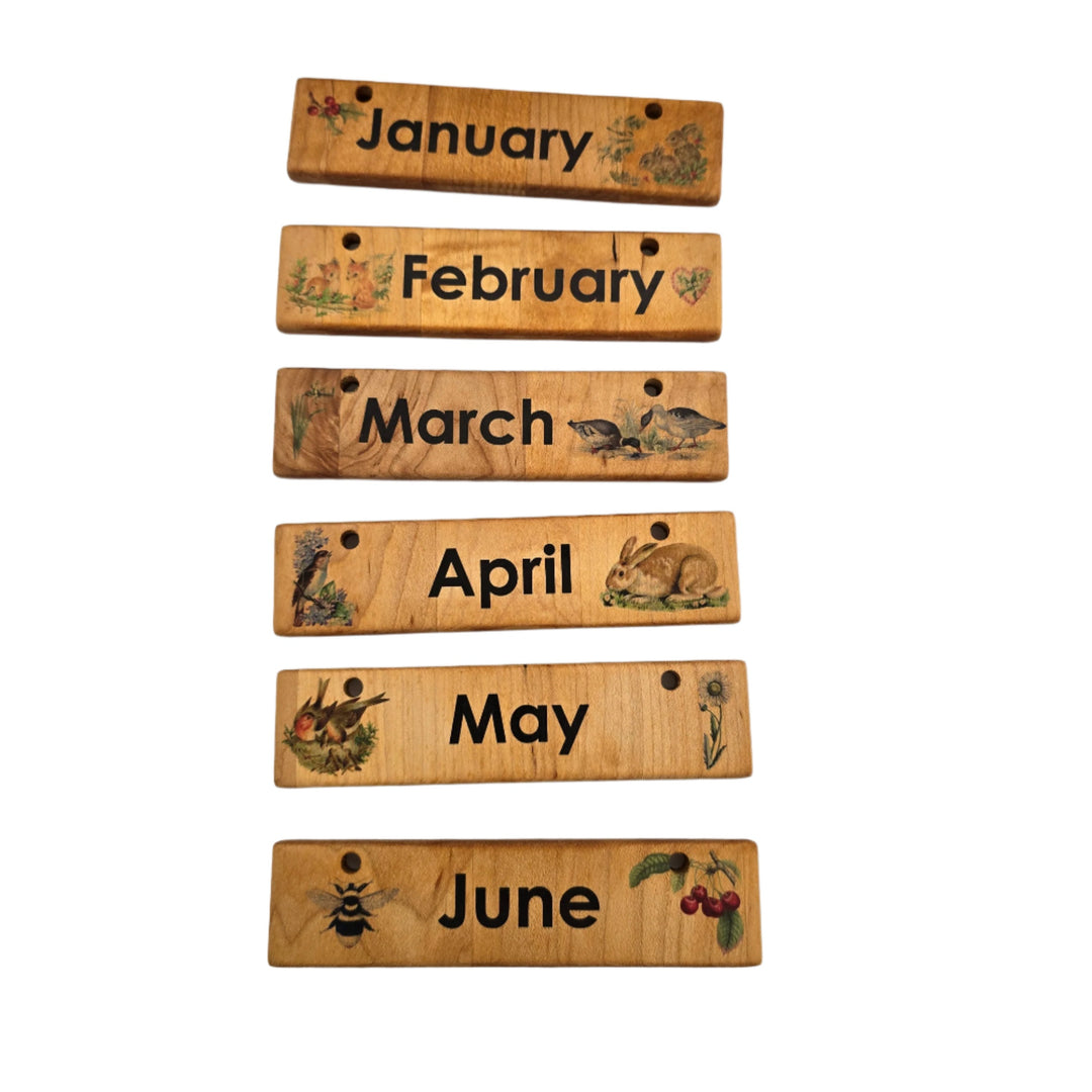 Treasures From Jennifer, Home Calendar. Our wooden perpetual Home Calendar is made from solid hardwood, high quality printing, and beautiful unique design. Wonderful for everyday use in your home and school. Ready to hang on the wall or pair with our Tabletop Stand for displaying on a flat surface (stand is not included). Pieces are all removable and give the child an interactive way to learn about time, weather, season, and upcoming events. The top pegs display your season and weather coins next to the mon