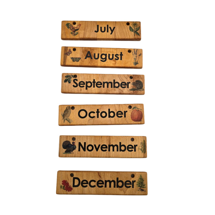 Treasures From Jennifer, Home Calendar. Our wooden perpetual Home Calendar is made from solid hardwood, high quality printing, and beautiful unique design. Wonderful for everyday use in your home and school. Ready to hang on the wall or pair with our Tabletop Stand for displaying on a flat surface (stand is not included). Pieces are all removable and give the child an interactive way to learn about time, weather, season, and upcoming events. The top pegs display your season and weather coins next to the mon