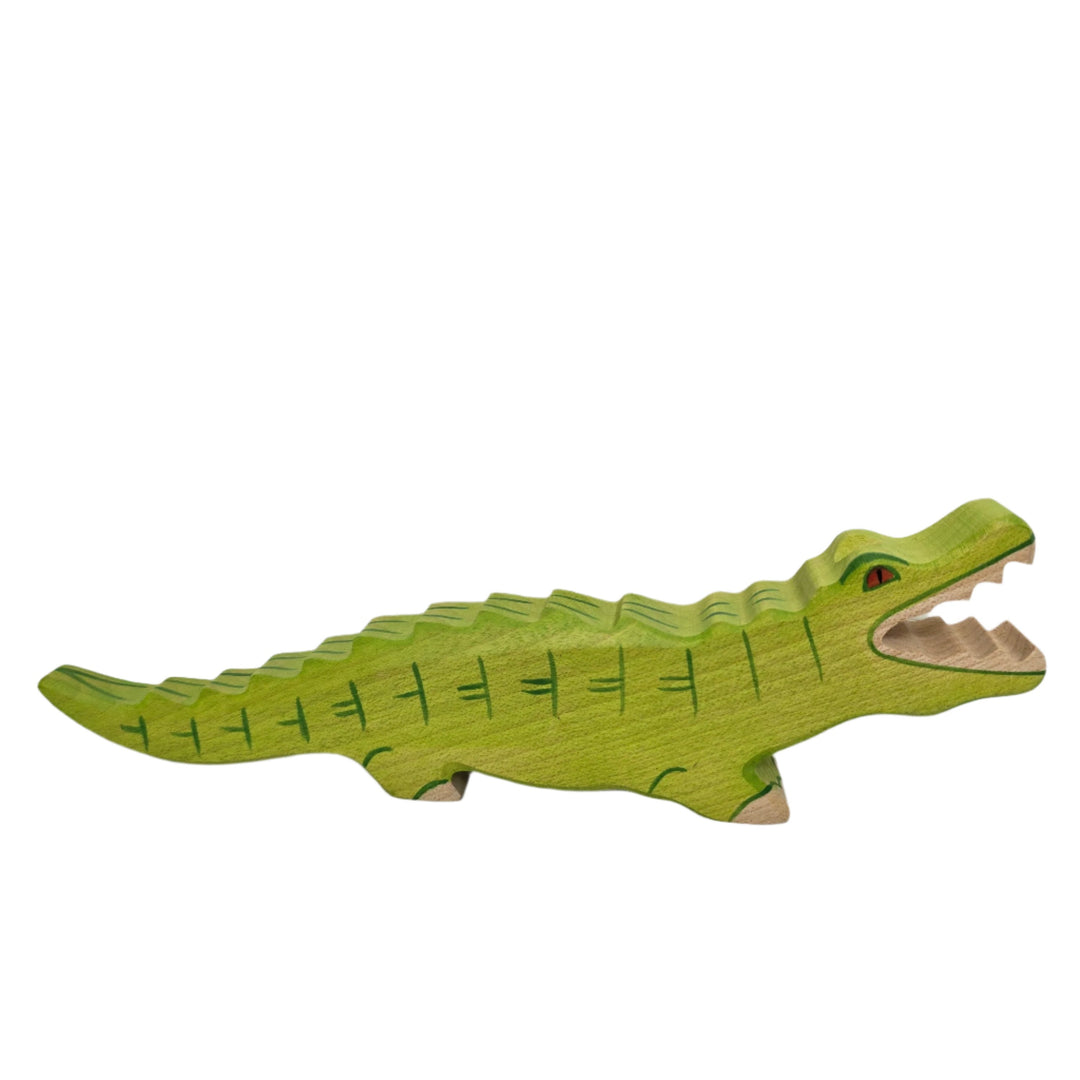 Holztiger, Holztiger Crocodile Toy Figurine, Wooden figures are large and chunky with rounded edges, and no upper age limit for playing; even adults are drawn to their simple charm. The minimalist forms of wooden figures combined with their chunkiness and hand made attention to detail ensure a child's imagination is stimulated allowing for hours of play and simultaneous learning. The toys are made predominantly of maple which is durable and characterized by attractive graining. They are sanded, dyed, painte