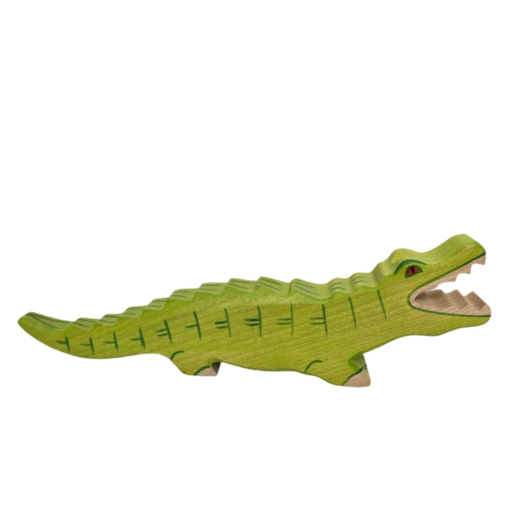 Holztiger, Holztiger Crocodile Toy Figurine, Wooden figures are large and chunky with rounded edges, and no upper age limit for playing; even adults are drawn to their simple charm. The minimalist forms of wooden figures combined with their chunkiness and hand made attention to detail ensure a child's imagination is stimulated allowing for hours of play and simultaneous learning. The toys are made predominantly of maple which is durable and characterized by attractive graining. They are sanded, dyed, painte