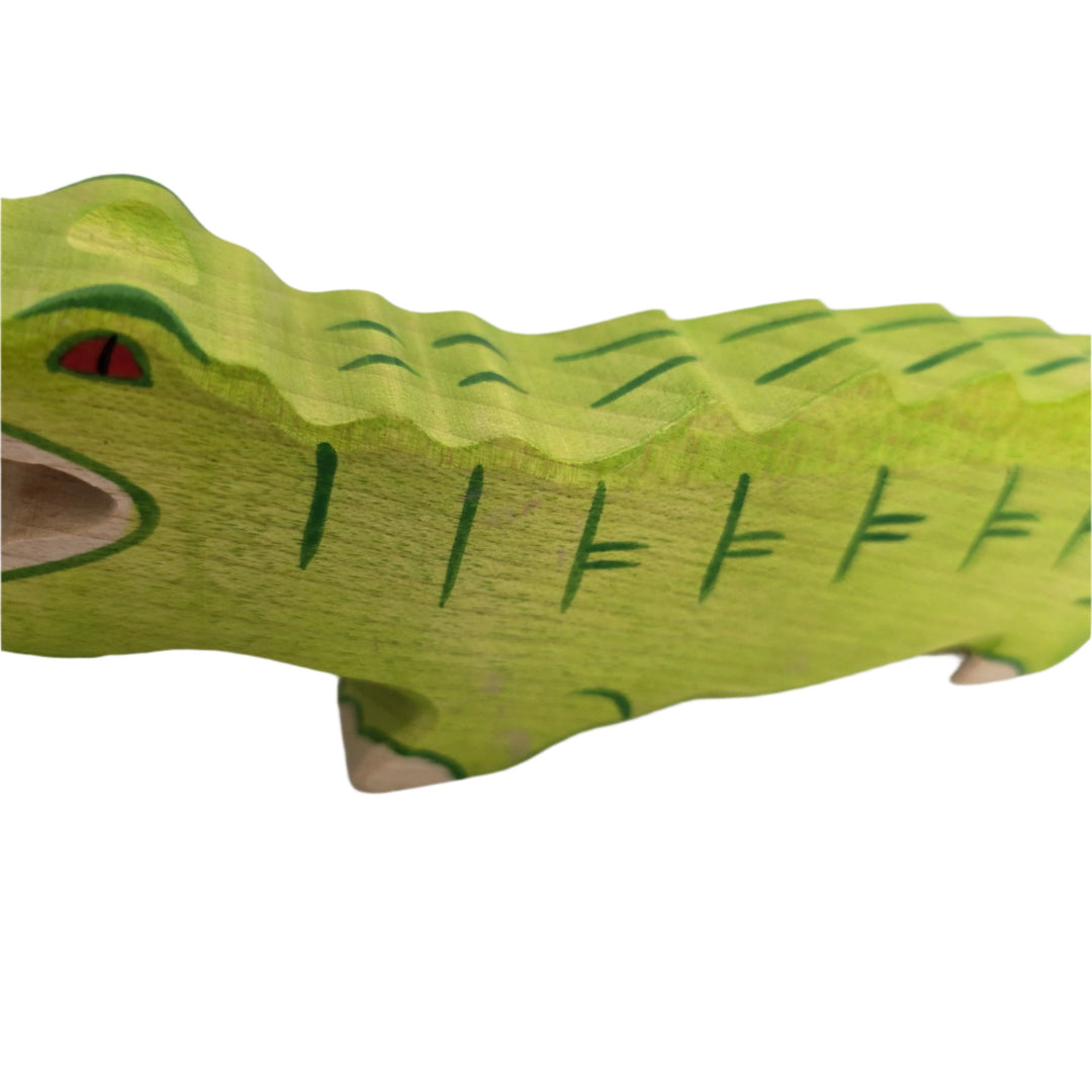 Holztiger, Holztiger Crocodile Toy Figurine, Wooden figures are large and chunky with rounded edges, and no upper age limit for playing; even adults are drawn to their simple charm. The minimalist forms of wooden figures combined with their chunkiness and hand made attention to detail ensure a child's imagination is stimulated allowing for hours of play and simultaneous learning. The toys are made predominantly of maple which is durable and characterized by attractive graining. They are sanded, dyed, painte