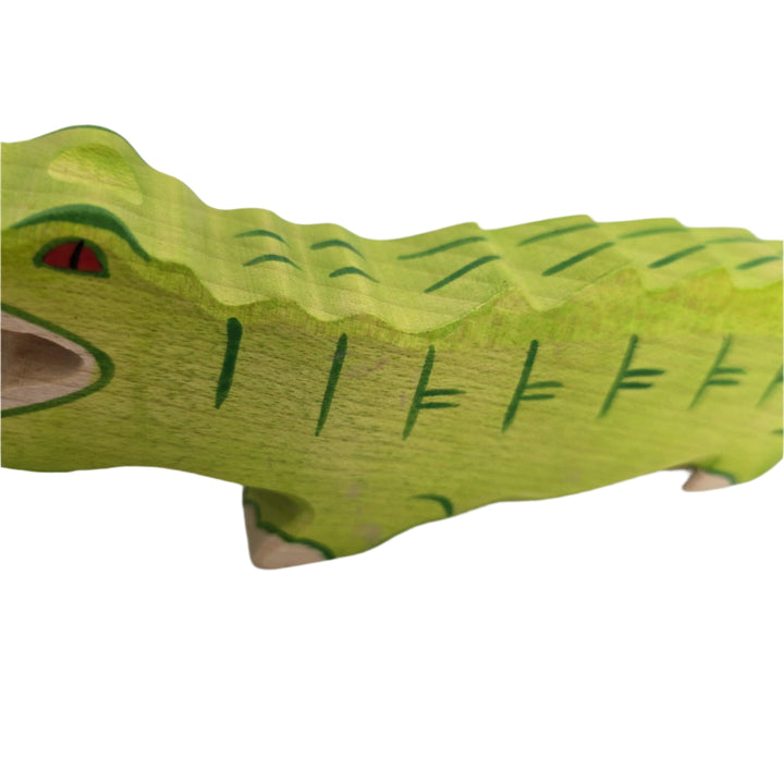 Holztiger, Holztiger Crocodile Toy Figurine, Wooden figures are large and chunky with rounded edges, and no upper age limit for playing; even adults are drawn to their simple charm. The minimalist forms of wooden figures combined with their chunkiness and hand made attention to detail ensure a child's imagination is stimulated allowing for hours of play and simultaneous learning. The toys are made predominantly of maple which is durable and characterized by attractive graining. They are sanded, dyed, painte