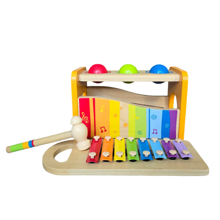 "Hape's Pound and Tap Bench with Slide Out Xylophone is a multifunctional musical delight and sound experience for toddlers.

Toddlers ages 12 months to 3 years can explore different notes and sounds by letting the balls fall on the keys or slide out the xylophone to create their own unique sound with a wooden mallet.

This musical instrument allows for different sounds and melodies making it the ideal introduction to the exciting world of music for your child."
