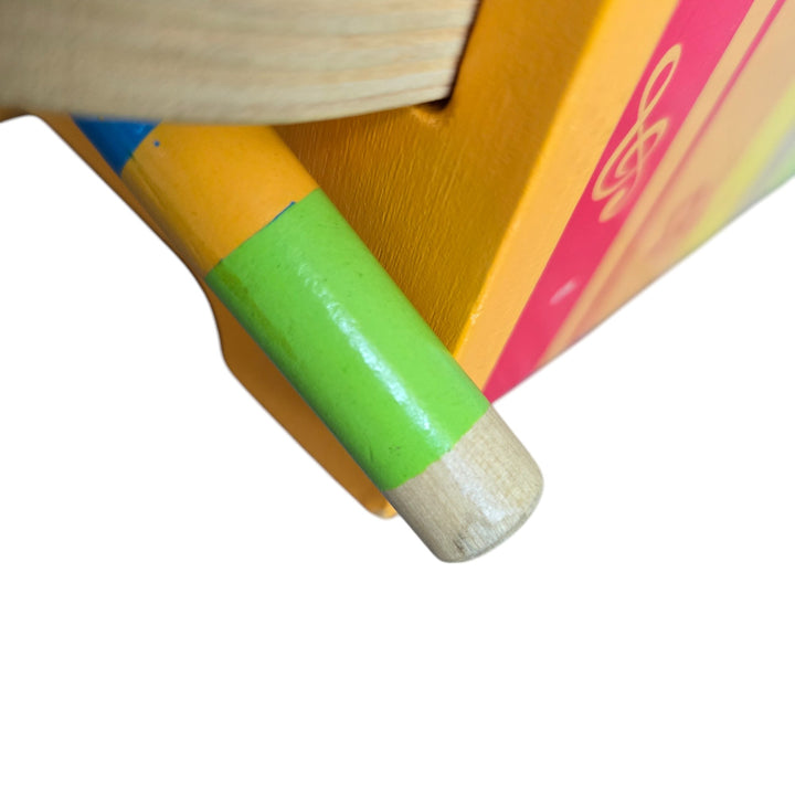 "Hape's Pound and Tap Bench with Slide Out Xylophone is a multifunctional musical delight and sound experience for toddlers.

Toddlers ages 12 months to 3 years can explore different notes and sounds by letting the balls fall on the keys or slide out the xylophone to create their own unique sound with a wooden mallet.

This musical instrument allows for different sounds and melodies making it the ideal introduction to the exciting world of music for your child."