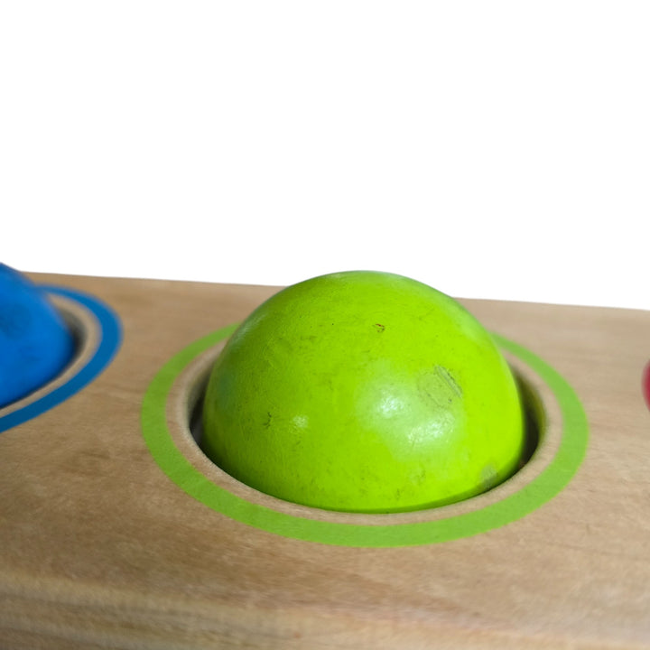 "Hape's Pound and Tap Bench with Slide Out Xylophone is a multifunctional musical delight and sound experience for toddlers.

Toddlers ages 12 months to 3 years can explore different notes and sounds by letting the balls fall on the keys or slide out the xylophone to create their own unique sound with a wooden mallet.

This musical instrument allows for different sounds and melodies making it the ideal introduction to the exciting world of music for your child."