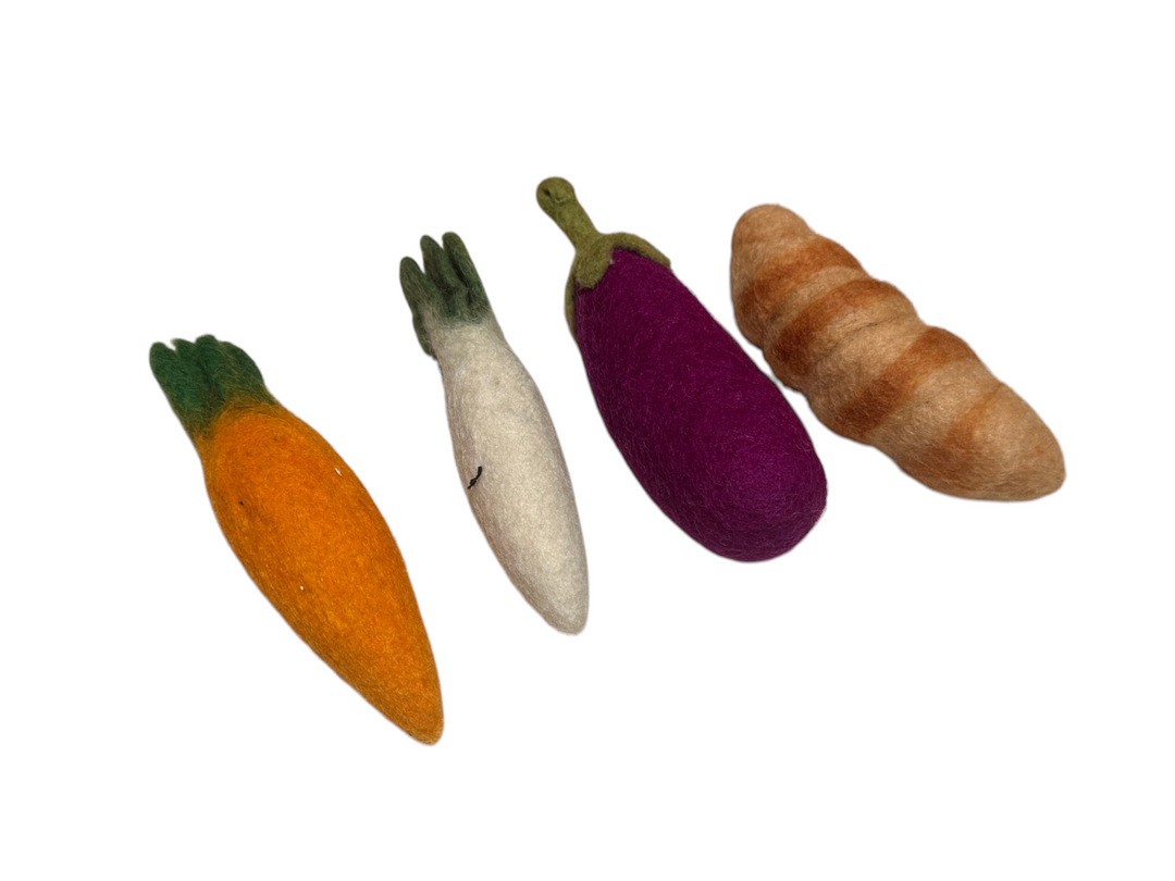 Bundle of veg and croissant with smiley faces